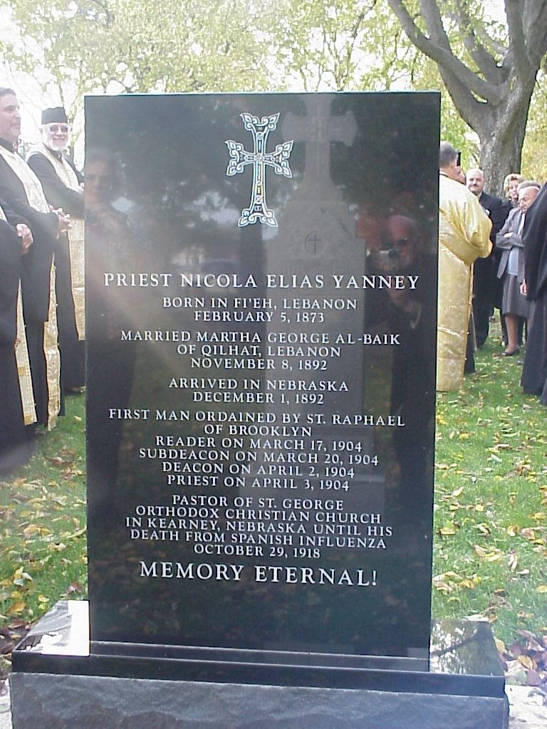 The headstone: Priest Nicola Elias Yanney, born in Fi’eh, Lebanon, February 5, 1873; pastor of St. George in Kearney until his death from Spanish influenza, October 29, 1918. Memory eternal!