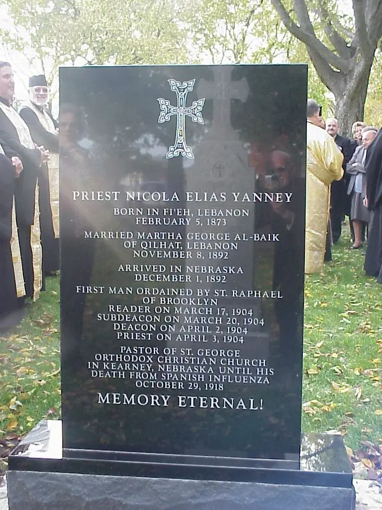 The headstone: Priest Nicola Elias Yanney, born in Fi&rsquo;eh, Lebanon, February 5, 1873; pastor of St. George in Kearney until his death from Spanish influenza, October 29, 1918. Memory eternal!